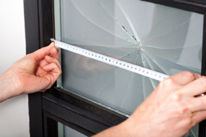 Worker from the Best Window Company in Geneseo IL preparing to repair glass in window