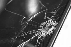 A cracked windshield needing Windshield Replacement in Monmouth IL