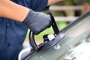 A team member from Glass Specialty WLC performs Windshield Repair in Warren County IL