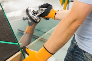 A team member of Glass Specialty WLC performs a Window Replacement in Kewanee IL