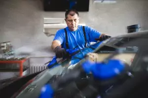 A member of Glass Specialty WLC performs a repair of Auto Glass in Kewanee IL